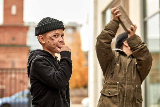 desperate boys commit a crime in city street, they have no shelter, food and money. street children