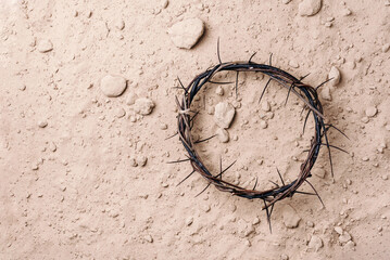 Crown of thorns over ground background. Top view. Copy space. Christian Easter concept. Crucifixion of Jesus Christ. He risen and alive. Jesus is the reason. Gospel, salvation - obrazy, fototapety, plakaty