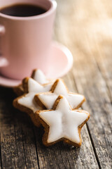 Icing gingerbread stars. Traditional Christmas cookies.