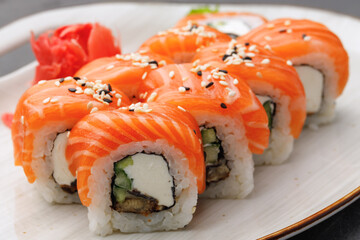 Philadelphia sushi roll on plate close up