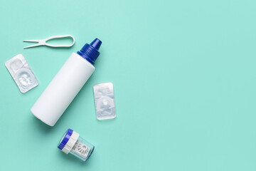 Container with contact lenses, solution and tweezers on color background