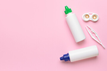 Container with contact lenses, solutions and tweezers on color background