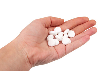 White pills for health care in hand isolated on the white