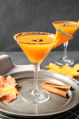 Glass of tasty pumpkin pie martini on table