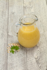 Dietary vegetarian oats milk over wooden