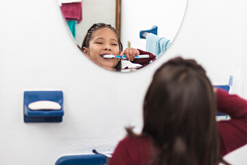 A girl brushing her teeth