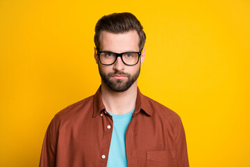 Photo of charming person look camera eyewear content face isolated on bright yellow color background