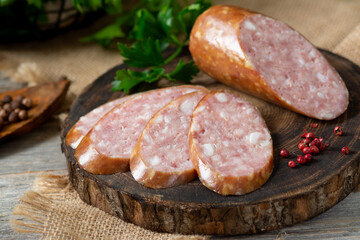 Sausage. Smoked sausage with spices on a wooden serving Board. Tasty meat sausages made from turkey meat. Copyspace	