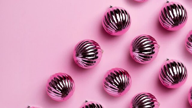 Beautiful ornaments for New Year decoration, New Year and Christmas Decoration,stopmotion on pink background top view