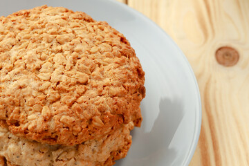 Oat cookies on wooden table close up