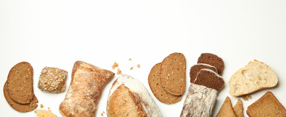 Different fresh baked bread on white background