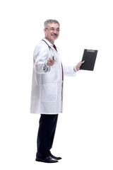 smiling doctor pointing to a blank space in the clipboard.