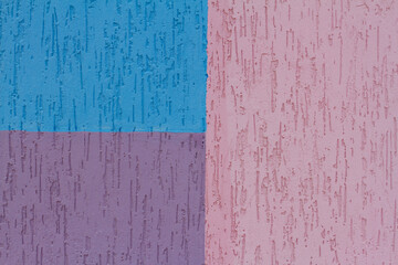 Colorful (blue, pink and purple) painted decorative wall as background, texture