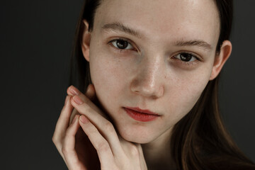 Fototapeta na wymiar Close-up emotional portrait of young woman