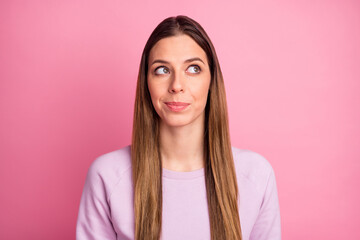 Close-up portrait of lovely straight-haired girl overthinking creating idea isolated over pink pastel color background
