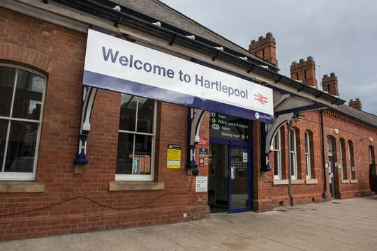 Welcome to Hartlepool sign over entrance to railway station.  Brick building exterior