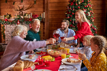 happy family having fun while having dinner together, on the eve of new year