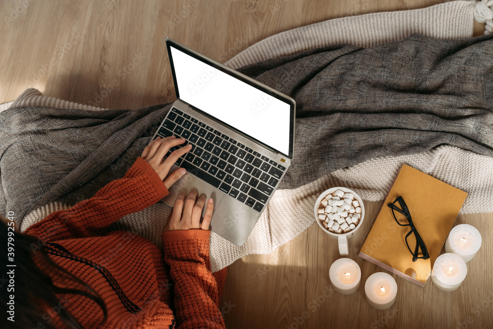 Fototapete top view of unrecognizable woman wearing a knitted sweater using laptop with copy space on the scree