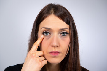 Fototapeta premium Close up of beauty woman pointing her eye