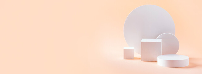 White geometric shapes podium for product display on beige background. Monochrome stage, stand for...