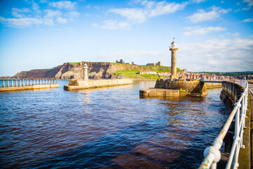 Fototapeta premium Pier and lighthouse of Whitby, Yorkshire, United Kingdom