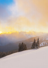 Sunrise over the mountain winter landscape.