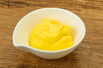 Natural cheese sauce in the bowl