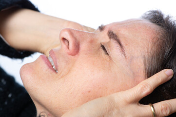 Woman have headache migraine stress or tinnitus - noise whistling in her ears.