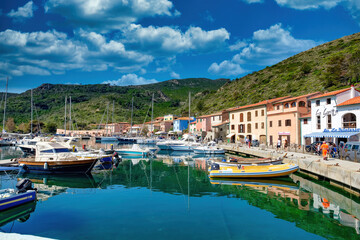 Fototapeta na wymiar Capraia Italy 04222018 Panorama of the small port and the town of the island of Capraia in the Tuscan Archipelago of Italy