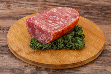 Beef ham piece over board