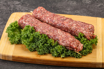 Raw minced beef kebab skewer
