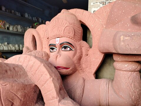 Prayagraj, Uttar Pradesh India- November 28 2020: Conceptual photo of Monkey God- Hanuman. Statue of lord Bajrang carved on the Red sand stone.