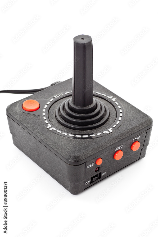 Wall mural Retro joystick with one orange button. Studio photo isolated on white background.