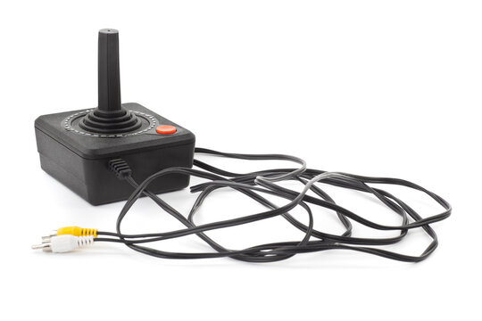 Retro joystick with one orange button. Studio photo isolated on white background.