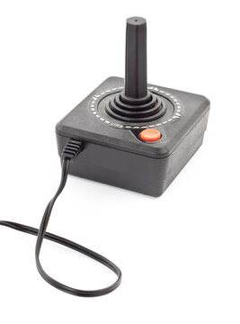 Retro joystick with one orange button. Studio photo isolated on white background.