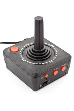 Retro joystick with one orange button. Studio photo isolated on white background.