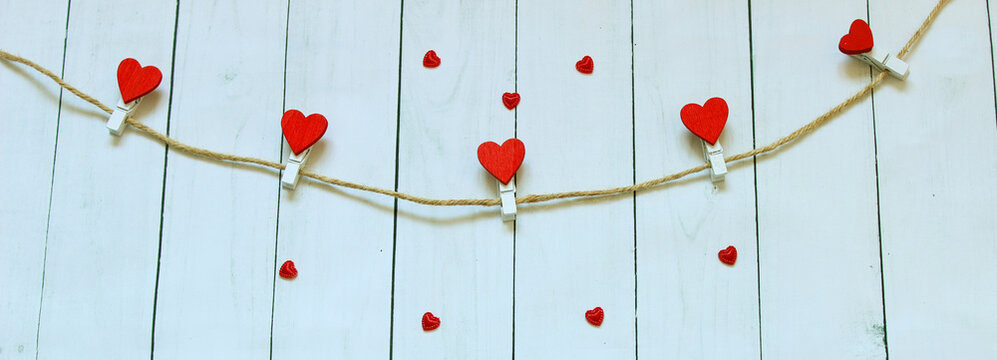 Red heart on a wooden background. Love story. Concept for a greeting card