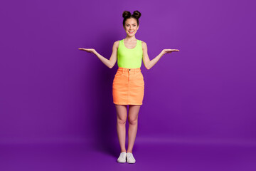 Full length photo of positive girl hold hand copyspace wear singlet sneakers isolated violet shine color background