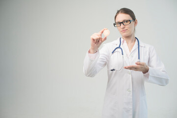 young doctor holds bitcoin in hand