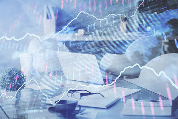 Double exposure of stock market graph drawing and office interior background. Concept of financial analysis.