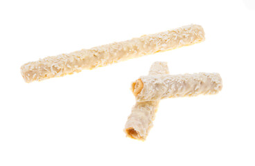 wafer rolls with coconut flakes isolated