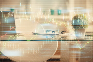 Double exposure of financial graph drawing and office interior background. Concept of stock market.