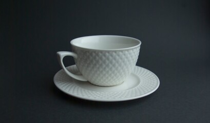 White tea Cup and saucer on a black background