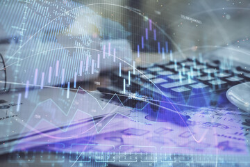 Double exposure of financial chart drawings and desk with open notebook background. Concept of forex market