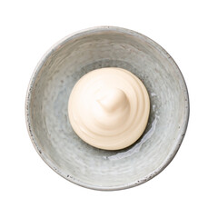White sauce, mayonnaise, mayo swirl in gray ceramic bowl isolated on white background. Top view.