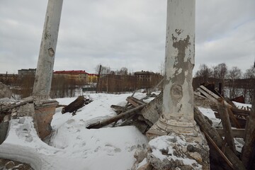 Dramatic sky with dark clouds above the ruins of an old building, Exterior details, columns...