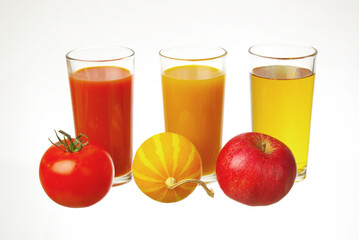 Three glasses with tomato, pumpkin, orange juice and tomato, pumpkin, orange on a white background.