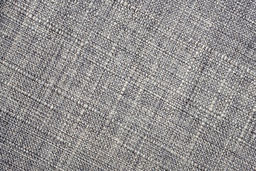 Top view fabric texture. Gray fabric for upholstery close-up. Textile background, diagonal lines. Abstract background from upholstery fabric for furniture in large knitting.