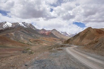 Scenic pastel color mountain landscape along Pamir Highway at high-altitude Ak Baital pass, Murghab district, Gorno-Badakshan, Tajikistan