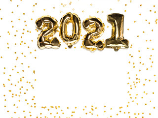2021 gold balloons with sparkles on white background. Frame composition with copy space. Flat lay or top view